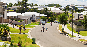 Families walking along a quiet suburban street